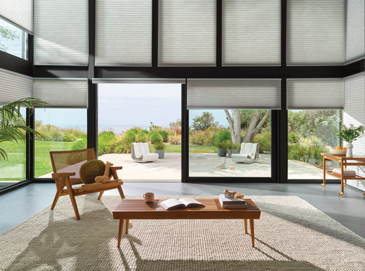 a large living room with a coffee table and wooden accent chair