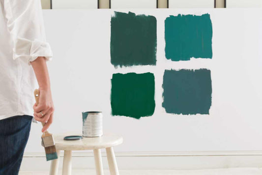 Four Green Paint Color Swatches on a White Wall
