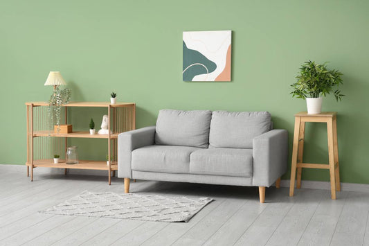 A living room with a green wall and gray floor at Red Star Paint near Montclair, NJ