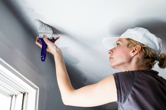 Someone painting a ceiling with white paint near Montclair, New Jersey (NJ)