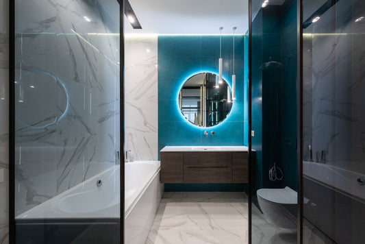 a remodelled bathroom with a blue accent wall