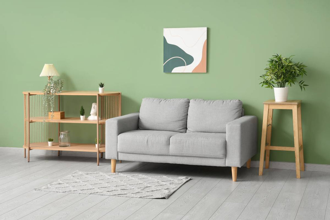 A living room with a green wall and gray floor at Red Star Paint near Montclair, NJ